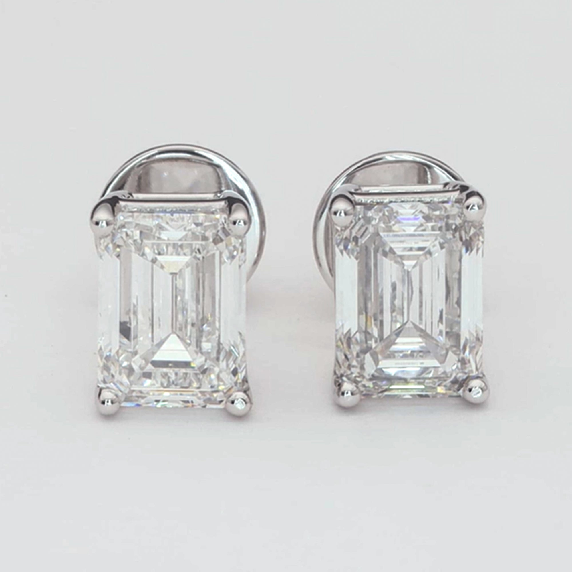 Solitaire Emerald Diamond Stud Earrings