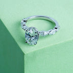 Marquise Side Stone Oval Solitaire Engagement Ring