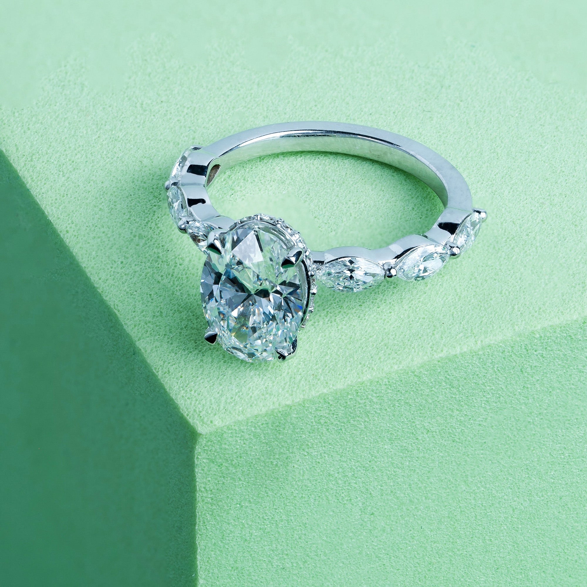 Marquise Side Stone Oval Solitaire Engagement Ring