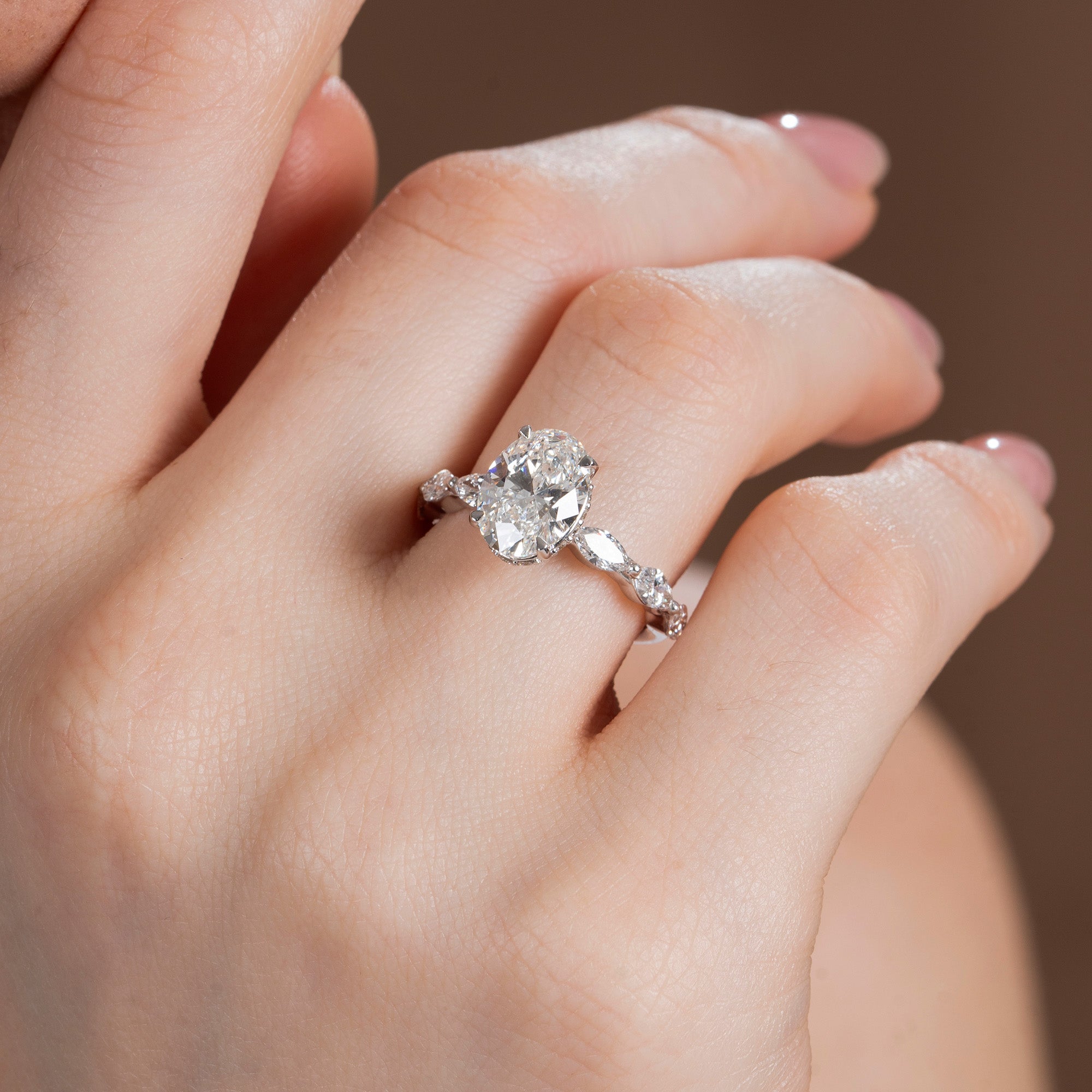 Marquise Side Stone Oval Solitaire Engagement Ring