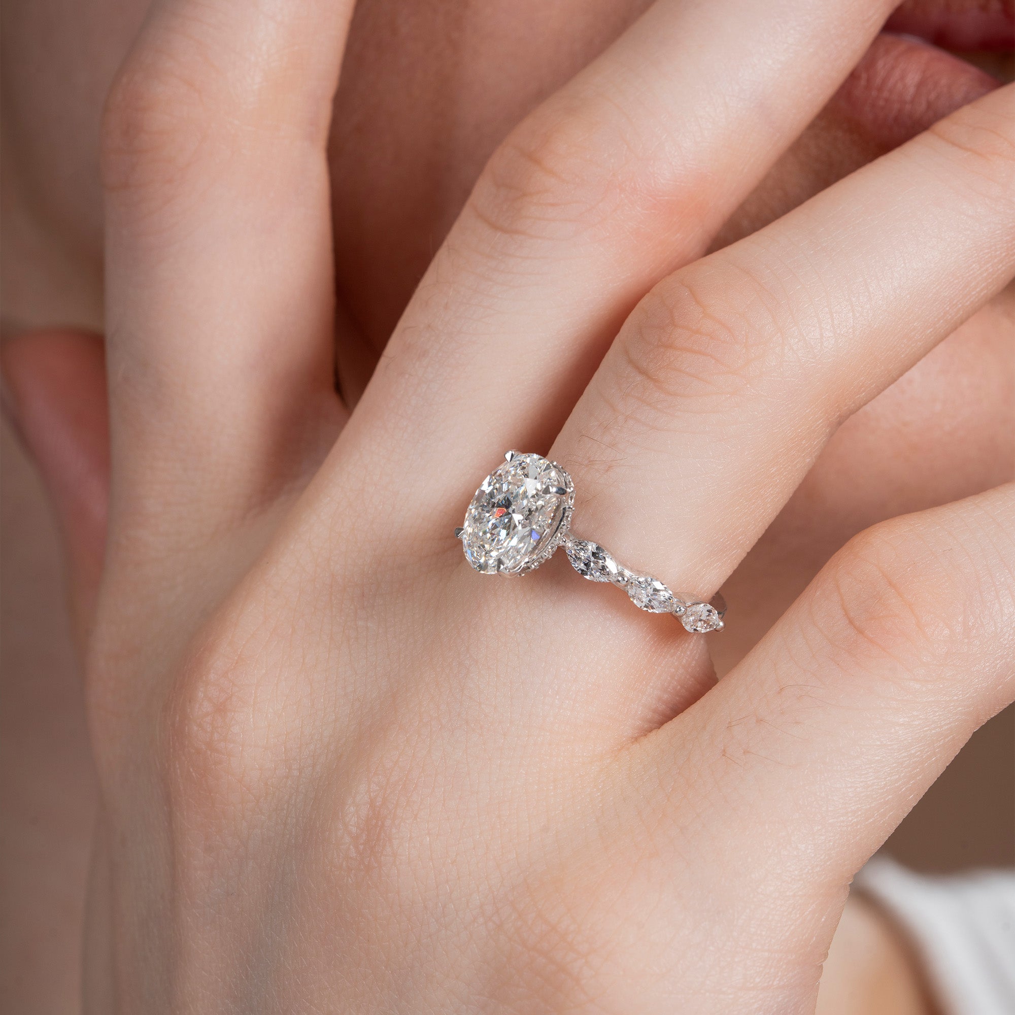 Marquise Side Stone Oval Solitaire Engagement Ring