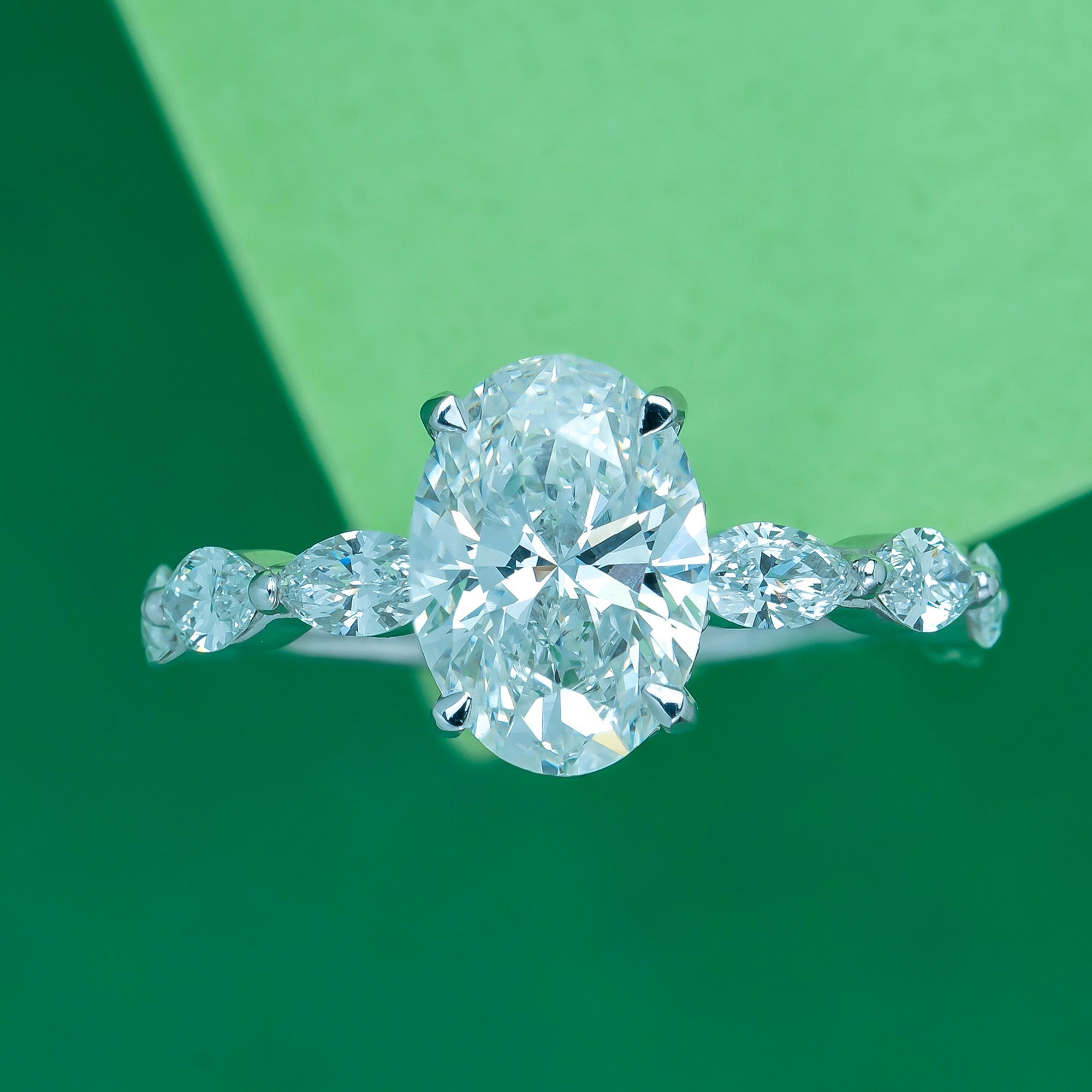 Marquise Side Stone Oval Solitaire Engagement Ring