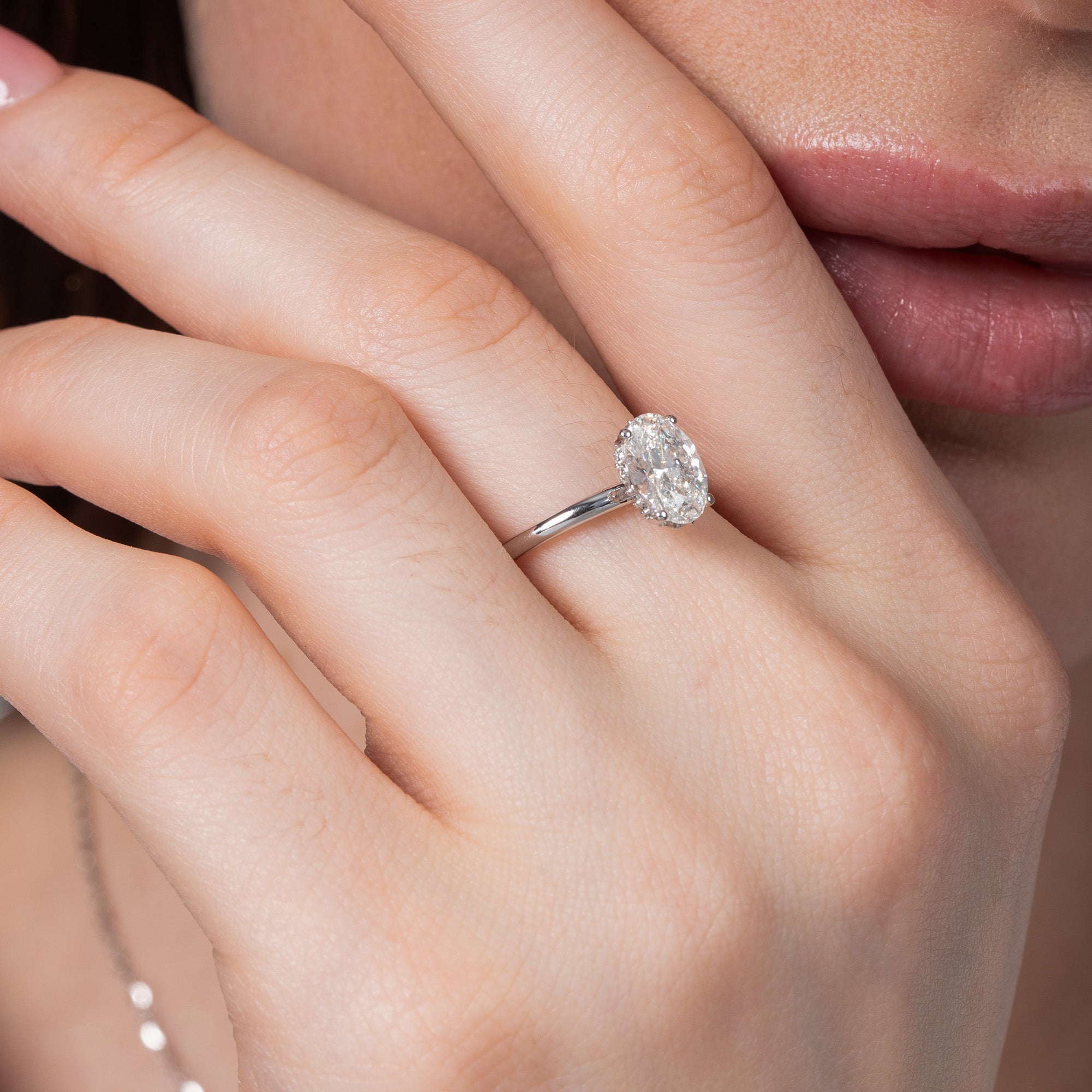 Oval Hidden Halo Solitaire Ring