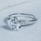 Six Prong Round Side Stone Engagement Ring
