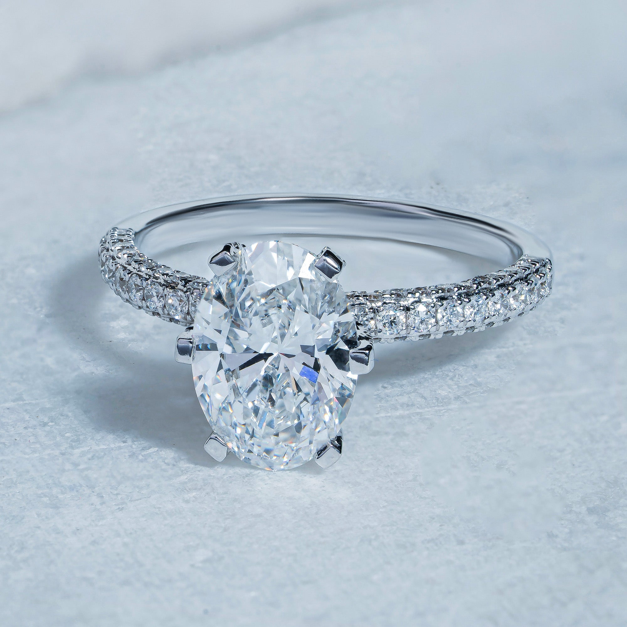 Six Prong Oval Side Stone Engagement Ring