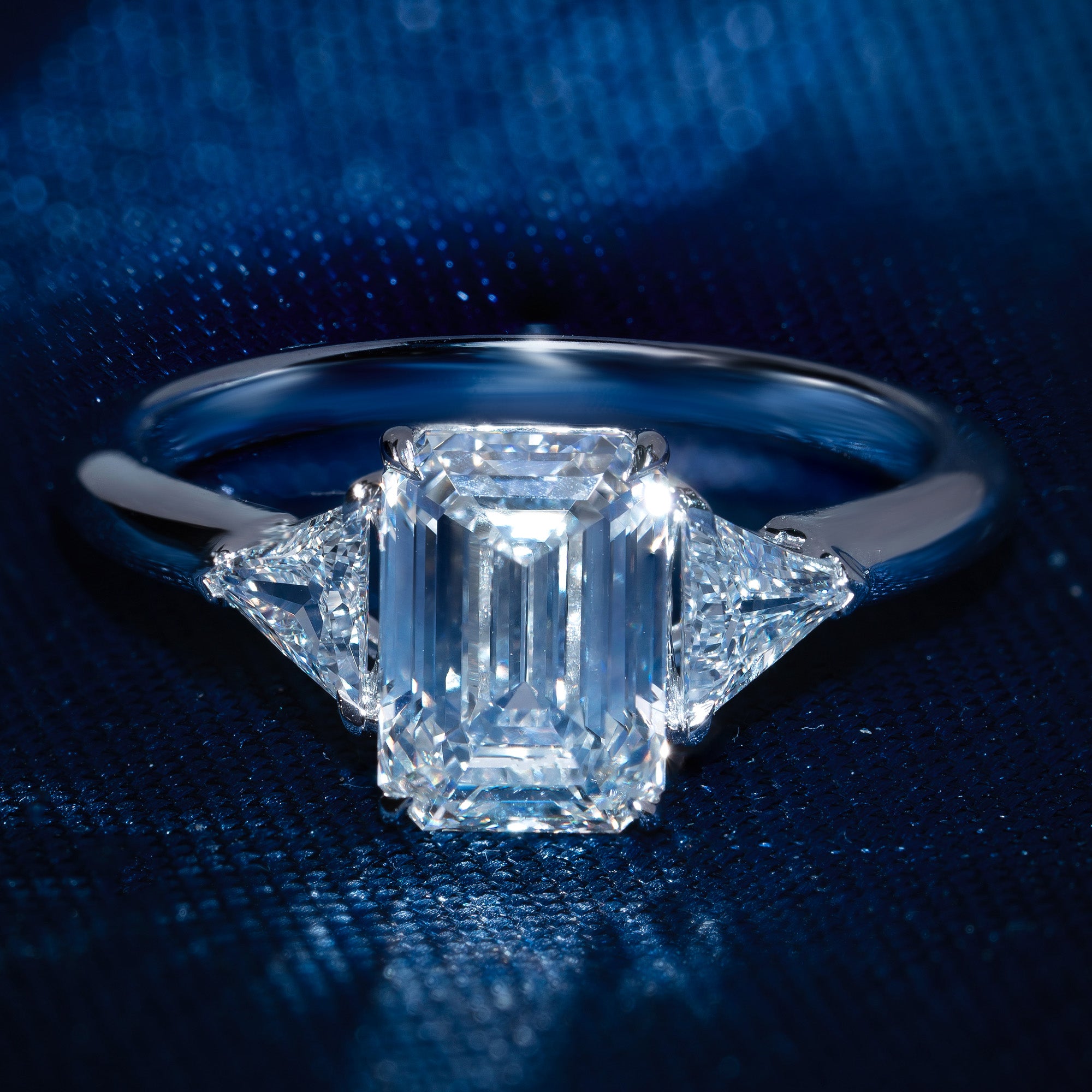 Sparkling Three Stone Emerald Engagement Ring