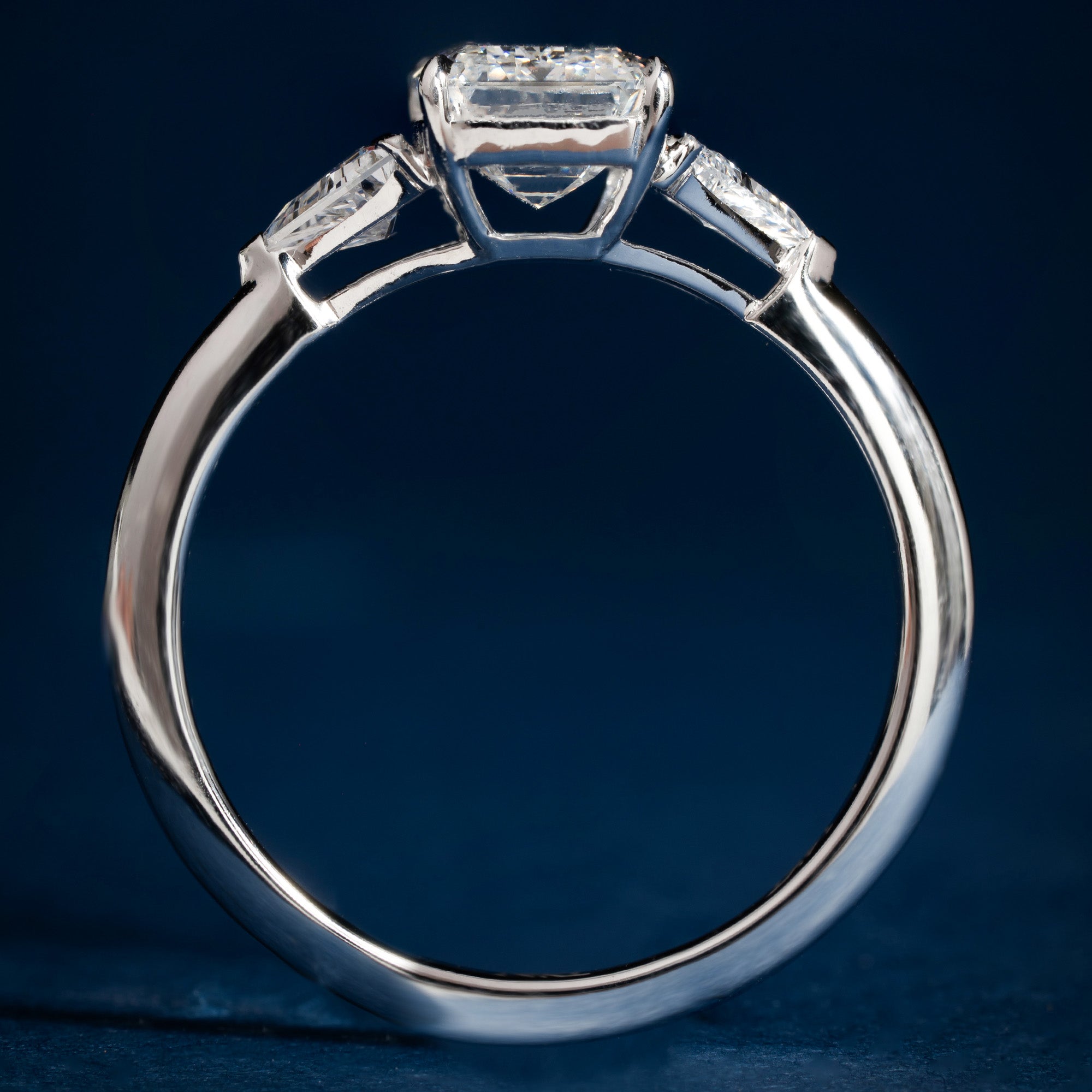 Sparkling Three Stone Emerald Engagement Ring