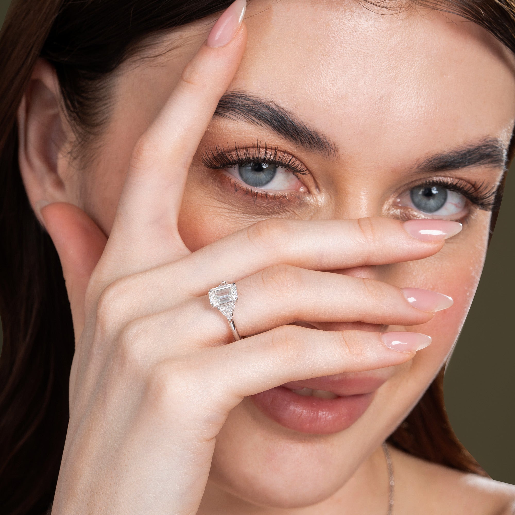 Sparkling Three Stone Emerald Engagement Ring