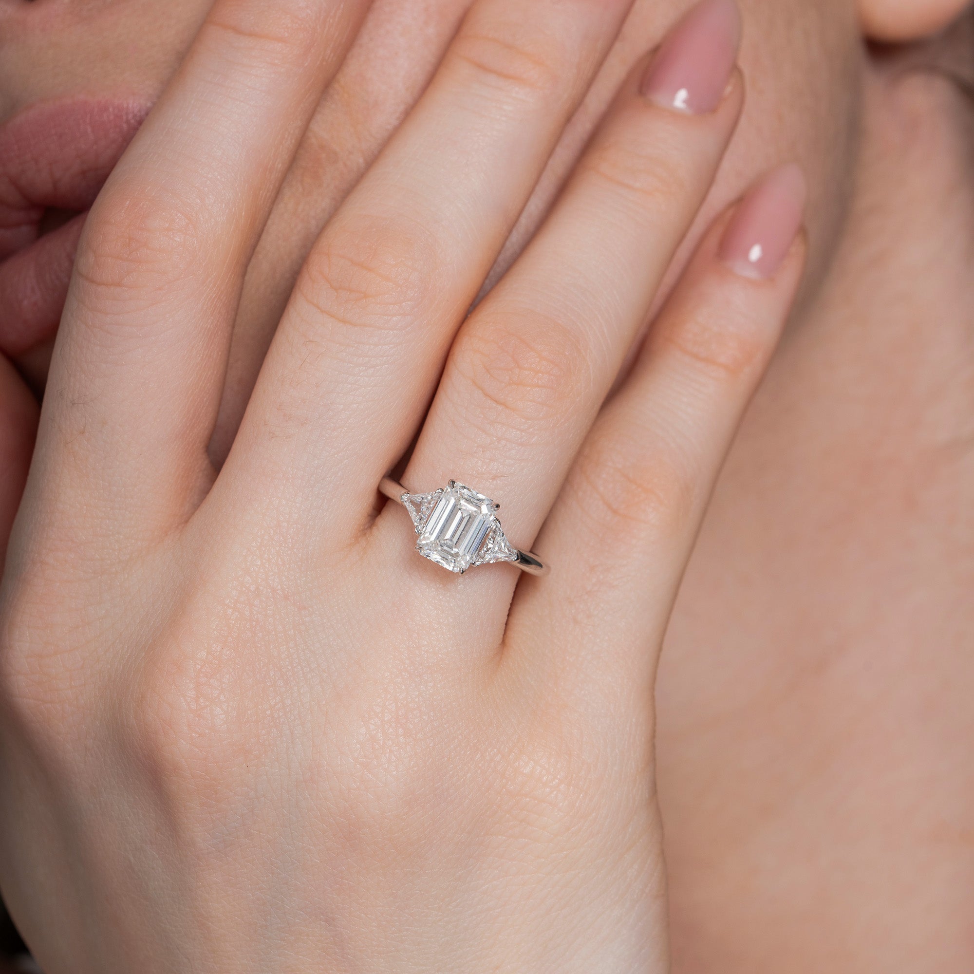 Sparkling Three Stone Emerald Engagement Ring