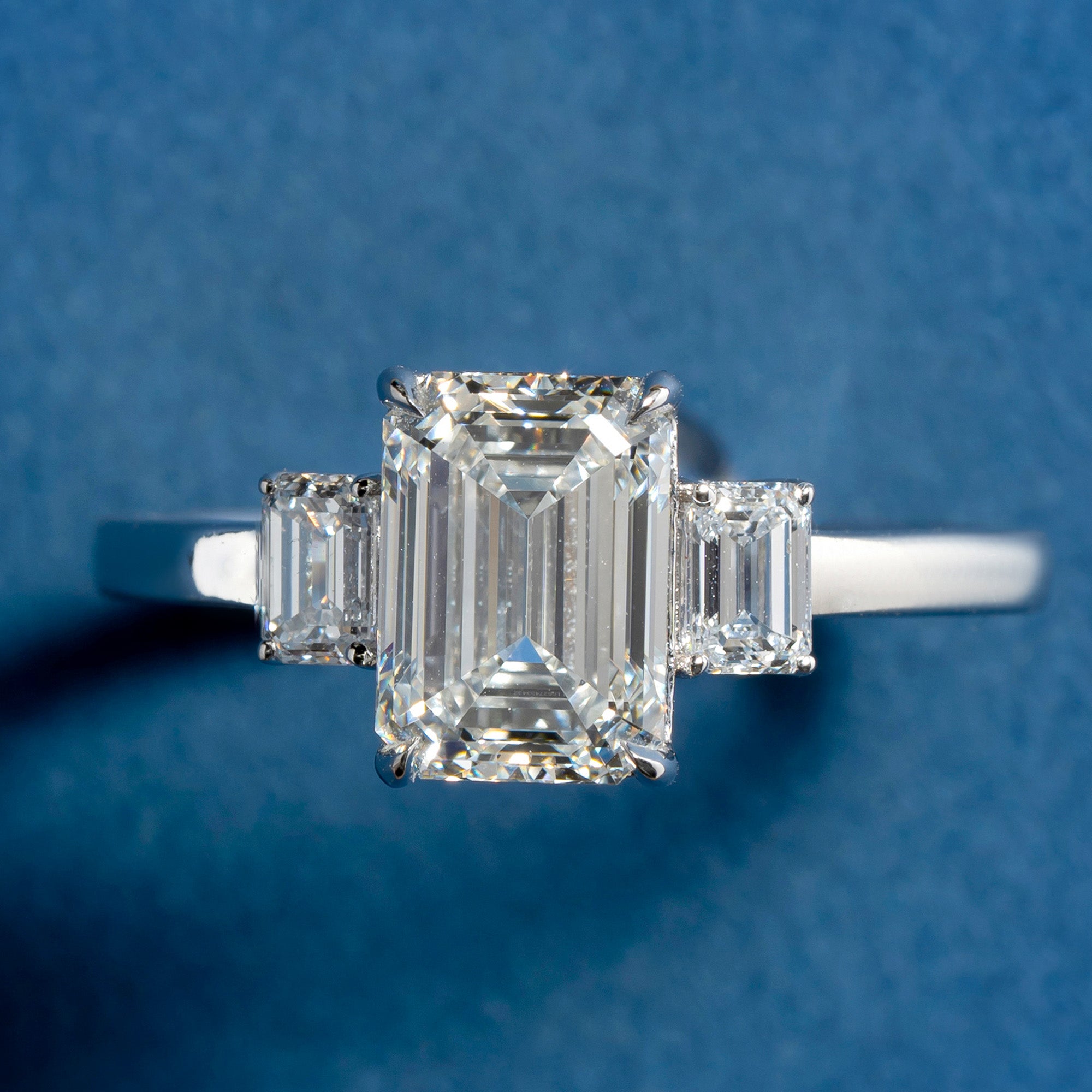 Glazing Three Stone Emerald Engagement Ring