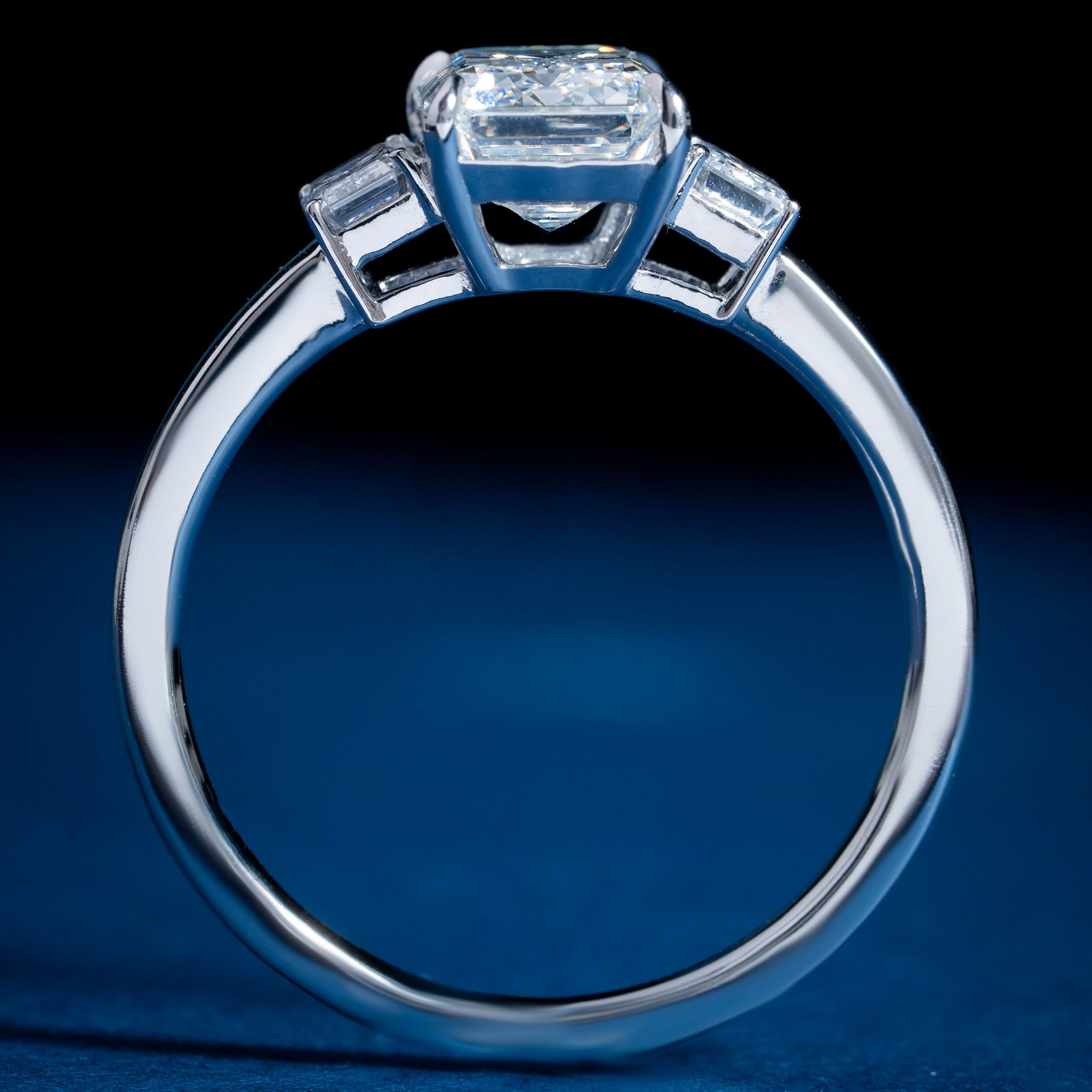 Burning Three Stone Emerald Engagement Ring