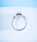 East-West Emerald Engagement Ring