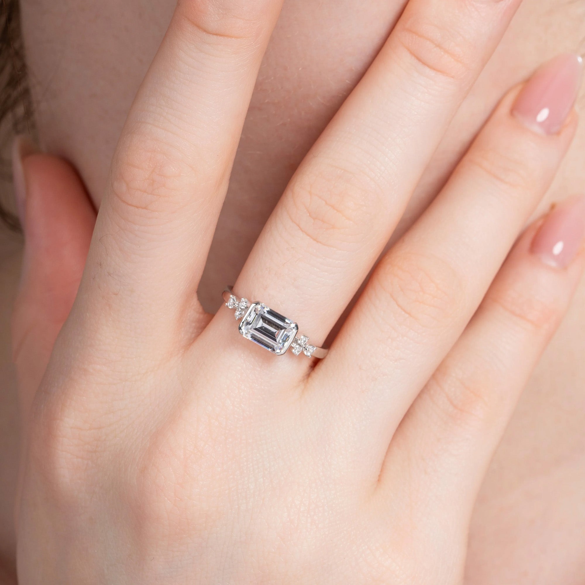 East-West Emerald Engagement Ring