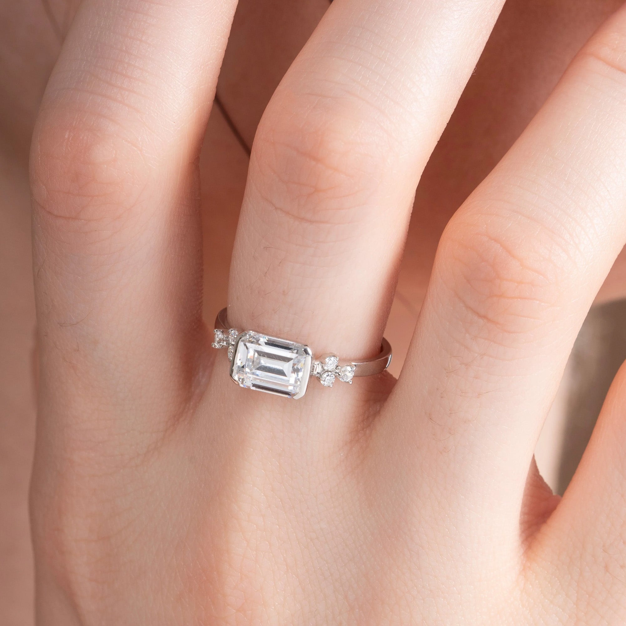 East-West Emerald Engagement Ring